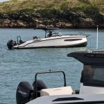 NAVAN S30 2025 luxury sports cruiser with twin Mercury 300 V8 engines, black hardtop, white hull, gold stripe, and premium SMART Edition features